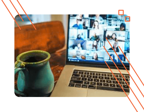 photography of a coffee mug next to a laptop on top of a desk representing the hybrid-first work environment at itential network automation