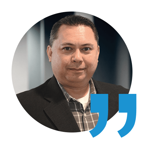 headshot of rich martin, an itential network automation employee, with a blue quotation mark on the bottom right corner