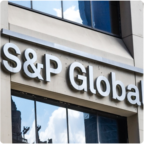 rectangular photo of an office building with the S&P global logo on it respresenting an itential case study on automating network services