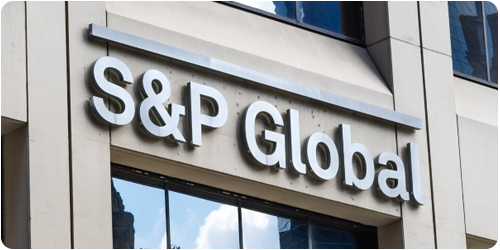 rectangular photo of an office building with the S&P global logo on it respresenting an itential case study on automating network services