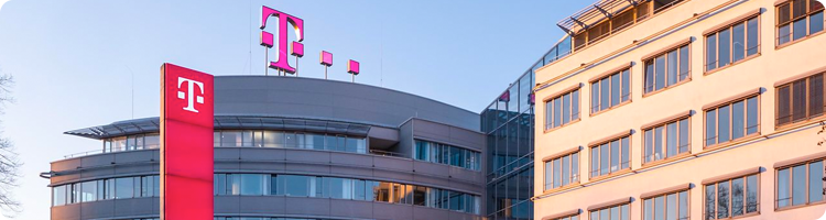 rectangular photo of an office building with the Deutsche Telekom logo on it representing an itential case study on network automation