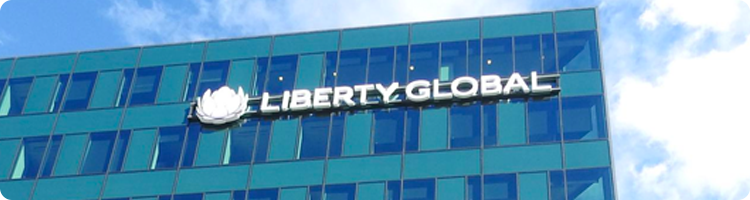 rectangular photo of an office building with the liberty global logo on it representing an itential case study on network automation